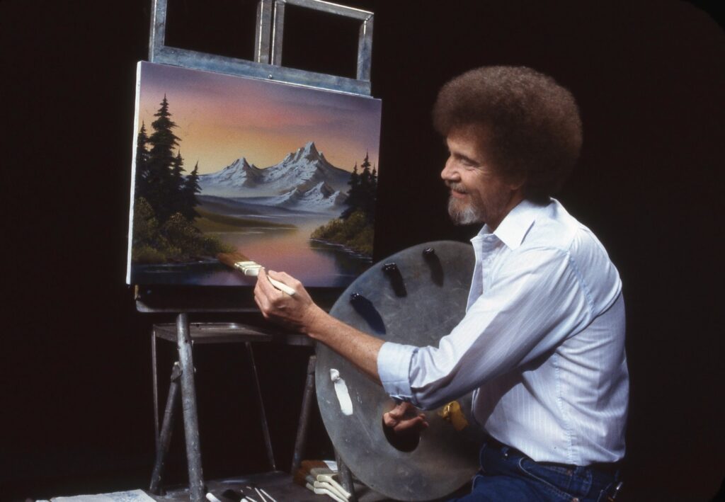 Bob Ross dipinge uno dei suoi quadri